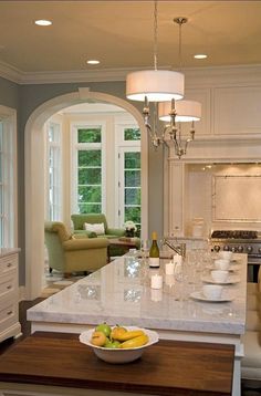 a large kitchen island with fruit on it