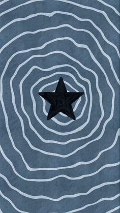 a black star floating in the middle of a blue and white swirly background with wavy lines