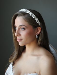 AVA Crystal and Pearl Headband Bridal Tiara WHAT WE LOVE: Experience the exquisite sparkle of the Ava Headband Tiara, reminiscent of the twinkling stars in the sky. The hand-wired faux pearls topped with tiny stunning crystals adorn a flexible crystal ladened headband, creating a romantic and luxurious accessory. DETAILS: Fine Austrian crystals and creamy faux pearl accents. Bobby Pin loops at the ends for added security while you are dancing the night away at your wedding! Tiara at its widest part : 0.875 Inches (0.34 CM) Comes in a Beautiful EDEN LUXE Bridal Signature Beribboned Keepsake Box. We are OBSESSED with pretty packaging! Model also wearing Kenza Earrings and Randi Necklace. (Sold separately.) SHIPPING TIMEFRAME: WORLDWIDE SHIPPING Made to Order and will ship out within approx. Bohemian Veils, Floral Veil, Pearl Bridal Headband, Silver Head Piece, Silver Tiara, Pearl Headpiece, Gold Tiara, Gold Headpiece, Headpiece Jewelry