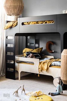 a child's bedroom with bunk beds and toys on the floor