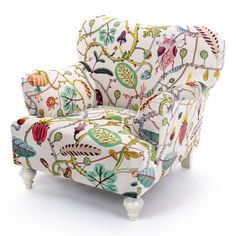 an upholstered chair with colorful flowers and leaves on the back, against a white background