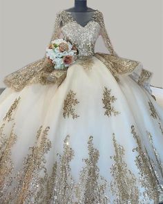 Vintage Style Tulle Ball Gowns Dress with gold lace appliques andlong sleeves,perfect for your 15th birthday party Style: 47099 Tailor Time: 15 to 24 days Customized :Yes Shipment Method: DHL,Fedex,Aramex Delivery Time: 3 to 7 Work Days Gold Ball Gown Quinceanera Dress For Party, Gold Ball Gown For Quinceanera Party, Gold Princess Dress For Quinceanera, Gold Long Sleeve Gown For Weddings, Beige And Gold Quinceanera Dress, Long Sleeve Ball Gown For Quinceanera And Prom Season, Gold Ball Gown Dress For Quinceanera, Gold Ball Gown For Quinceanera During Prom Season, Gold Ball Gown For Quinceanera