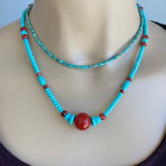 FREE Domestic Priority Shipping Natural, stunning sky blue Campitos Turquoise with Red Coral center bead and a few red Spiny Oyster combine to make an adjustable 18 to 19 inch necklace.  This piece is understated and easy wear.  Campitos Turquoise is mined in Mexico directly south and in the same vein that Sleeping Beauty Turquoise is found.  Sky blue color is a hallmark of this rare turquoise along with natural stability. This design is finished with a easy and secure hinged clasp and paw print charm both in 92.5 Sterling.  Tiny Fine Sterling beads protect the wire and make a clean Sterling finish.  Unique Turquoise necklace to wear or collect :)  Love it's easy feel and perfect color 😊 ITEM # T 11             Necklace Length:  Adjustable 18-19 inch Campitos Turquoise:  Natural smooth pu Paw Print Charm, Sky Blue Color, Spiny Oyster, Sleeping Beauty Turquoise, Coral Turquoise, Red Coral, Necklace Length, Easy Wear, Paw Print