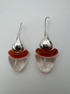 Vintage Gerda Lynggaard for Monies sterling silver and lucite pierced earrings Great modernist style earrings featuring a sterling silver drop with clear and amber colored lucite  In very good condition  Measures 1.75" 2024 Modern Lucite Earrings, Contemporary Pierced Teardrop Earrings, Unique Hallmarked Teardrop Earrings, Unique Teardrop Hallmarked Earrings, Modern Clear Earrings As Gift, Modern Clear Drop Earrings, Modern Clear Earrings As A Gift, Modern Clear Earrings For Gifts, Modern Clear Earrings For Formal Occasions