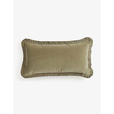 a tan pillow with ruffled edges