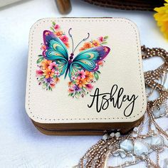 a white wallet with a butterfly on it