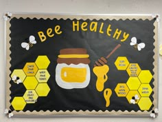 a bulletin board with bees and honey on it