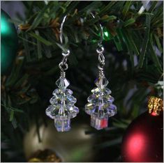 These earrings are just stunning and a perfect stocking stuffer! These earrings are Christmas Trees made from sparkling crystal and has aurora borealis hues to give that extra sparkle! Swarovski Christmas Tree, Christmas Jewelry Diy, Swarovski Christmas, Crystal Christmas Tree, Crystal Christmas, Tree Earrings, Christmas Tree Earrings, Crystal Tree, Jewelry Making Project