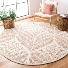 a white and beige area rug in a living room with a chair, potted plant and wicker basket on the floor