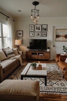 a living room filled with furniture and a flat screen tv on top of a wooden table