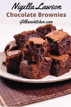 chocolate brownies on a plate with one cut in half