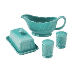 a teal colored ceramic set with matching cups and saucers on a white background