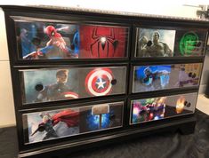 the drawers are decorated with images of superheros