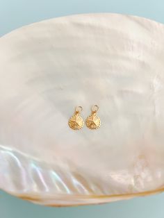 One set of 14k Gold Filled Sand Dollar Earring Charms! This listing is just for a set of charms! Sand Dollar Charms are around 0.35". Mix & match your earrings by switching out your charms with the other options we have! Link to buy the hoops you will put the charms on: https://shopmermaidandme.com/products/goldie-hoops What you need: 1 pair of our Goldie Hoops, and 1 set of our Earring Charms to get started! How to put your charms on your hoops: Open the earring & slide charm over the earring h Sand Dollar Earrings, Earrings Charms, Earring Charms, Sand Dollar, Gold Filled Jewelry, One Set, Hair Claw, Charm Earrings, Mix Match