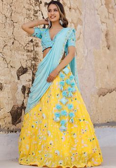 Readymade Faux Georgette Lehenga in YellowThis attire with Cotton and Shantoon Lining is Enhanced with Enhanced with Fancy Tassels, Resham and Sequins Work in Bird MotifsAvailable with a Faux Georgette Sky Blue Choli Crafted in Plunge Neck and Short Sleeves and a Faux Georgette Dupatta in Sky BlueThe Choli and Lehenga Lengths are 15 and 42 inches respectivelyDo Note: Accessories shown in the image are for presentation purposes only. (Slight variation in actual color vs. image is possible). We se Sky Blue And Yellow Outfit, Blue Haldi Outfit, Yellow Embellished Anarkali Set With Traditional Drape, Yellow Floral Embroidered Sharara For Reception, Traditional Yellow Embellished Saree, Yellow Floral Embroidery Sharara For Reception, Traditional Embellished Yellow Saree, Reception Yellow Floral Embroidered Sharara, Embellished Yellow Choli With Traditional Drape