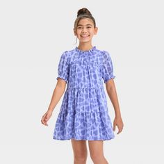 Update your kid's casualwear with this Short-Sleeve 'Heart' Woven Dress from Cat & Jack™. This dress is crafted from lightweight satin fabric with lining to lend comfortable all-day wear, and the behind-the-neck button closure makes dressing easy. Designed with a functional side pocket, this heart-printed dress features a ruff collar, smocked elbow sleeves and a tiered hem for sweet style. They can add sandals, slip-ons or sneakers to complete the look. Cat & Jack™: Designed for all children so Ruff Collar, Floral Printed Dress, Velour Dress, Periwinkle Blue, Kids Outfits Girls, Polyester Satin, Sweet Style, Woven Dress, Printed Dress