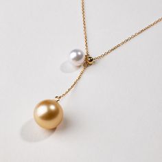 Material: Golden South Sea Pearl, Akoya Pearl, and 18K gold Golden South Sea Pearl and Akoya Pearl saltwater cultured pearl The South Sea gold pearl is the Deep Gold grade Size of Golden South Sea Pearl: 10.0-11.0 mm Size of Akoya Pearl: 6.5-7.0mm Length of Chain: around 45 cm (adjustable) Handpicked of every pearl, only the top 1% of pearls are selected Lifetime warranty Luxury Akoya Pearl Jewelry With Pearl Charm, Timeless Yellow Jewelry For Formal Occasions, Gold Akoya Pearl Jewelry With High Luster, Yellow Gold Akoya Pearl Jewelry, Yellow Gold Akoya Pearl Round Jewelry, Yellow Gold Jewelry With Akoya Pearl, Fine Jewelry In Yellow Gold With High Luster, Yellow Gold Fine Jewelry With High Luster, High Luster Yellow Gold Fine Jewelry