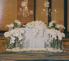 a table with flowers and candles on it