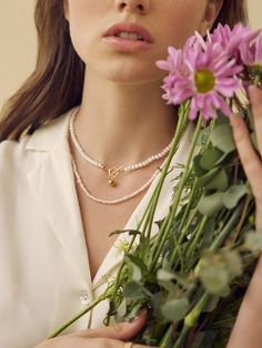 Easy to style and endlessly versatile, the Elena Pearl Choker is the epitome of beauty and elegance. Don’t have time to stylize yourself? Let this exquisite white pearl choker with gold-plated over brass string make a true fashion statement. This beautiful neckpiece is the perfect pick to pair up with casual jeans and a t-shirt.- Gold plating over brass- Freshwater pearl Elegant White Choker For Everyday Wear, Chic Pearl Choker Necklace For Gift, Chic Pearl Choker Necklace, Elegant Metal Pearl Choker Necklace, Elegant Adjustable Pearl Choker, Delicate Pearl Choker With Charm, Chic Gold Pearl Choker, Fruit Jewelry, Pearl Choker