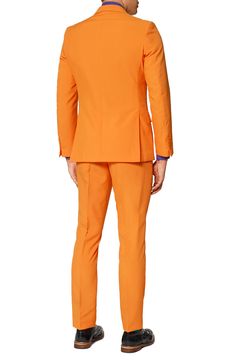 Formal style doesn't have to be rigid and boring. Make it fun with this bright orange two-piece suit and go against the grain with fresh, bold personality. Tailored for a modern fit, it includes a two-button suit jacket and trousers cleanly styled with tonal buttons and stitching, as well as a matching tie to pull the whole outfit together. Jacket has a two-button closure, notch lapels; nonfunctional four-button cuffs; chest pocket; front flap pockets; side vents. Trousers have a zip fly with bu Orange Fitted Blazer For Work, Orange Notch Lapel Suit For Work, Spring Orange Tailored Suit, Orange Tailored Suit With Notch Lapel, Orange Suits For Spring Formal Events, Fitted Orange Workwear Sets, Orange Workwear Sets For Summer, Orange Summer Workwear Sets, Summer Orange Workwear Sets