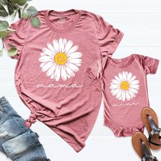 Mommy And Me Shirts, Mama Mini Shirt, Cute Mom baby Shirt, Daisy Mom Shirt, Mama Shirt, Matching Shirt, Flower Mom Shirt, Mother day Shirt. HI! Welcome to my store, I'm delighted to see you here. My store's main goal is to provide you with premium everyday apparel with the best graphic t-shirts. I see you as a friend, not just a customer. I'm sure you'll love my designs. You can order the same design 4XL and 5XL large sizes from the link, please specify the details in the order note.   https://e Cute Crew Neck Tops For Mother's Day, Family Matching Letter Print Shirt For Spring, Family Matching Crew Neck Shirt For Spring, Casual Cartoon Print Top For Mother's Day, Family Matching Cotton Tops For Spring, Spring Family Matching Long Sleeve Tops, Family Matching Long Sleeve Tops For Spring, Casual Tops With Cartoon Print For Mother's Day, Pink Relaxed Fit Tops For Mother's Day