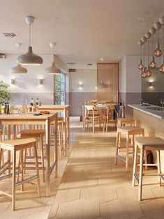 an empty restaurant with wooden tables and stools