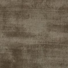 an upholstered fabric textured with dark brown and light grey tones, suitable for use in curtains or upholstering