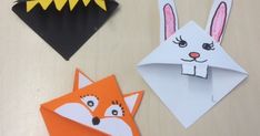 three different types of paper animals on a table