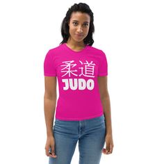 a woman wearing a pink t - shirt with chinese characters on it