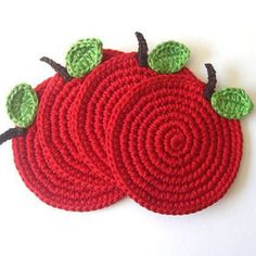 two crocheted apples sitting on top of each other