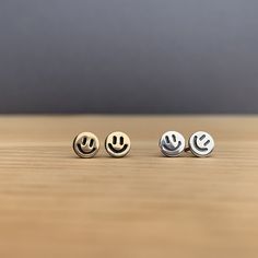 Because the world can always use a little more happiness! These studs measure approximately 6mm in diameter and are made of either sterling silver or brass with sterling silver posts or 14k gold fill with gold fill posts. Each pair of earrings is handmade, from start to finish, so please allow for slight variations in your earrings from those that you see here.  These little guys are great alone or stacked up with other earrings! The brass earrings are sealed to reduce tarnishing. To keep your e Fun Stud Earrings, Earrings Aesthetic Stud, Smile Earrings, Violet Earrings, Ears Pierced, Cute Stud Earrings, Jewelry Aesthetic, Mini Earrings, Mini Studs