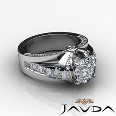 a white gold ring with diamonds on it and a diamond set in the middle,