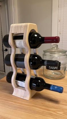 a wooden wine rack holding two bottles of wine