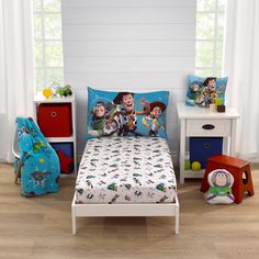 a child's bedroom with toy story bedding and toys