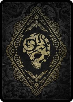 a black and gold book with a skull on it