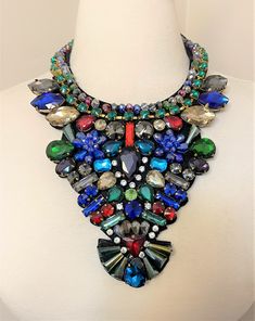 "Gorgeous Huge Rhinestones Multi Color Bib Necklace all prong large rhinestones on black felt with tied ribbon, It measure 13\" long plus the ribbon, bib 7\" wat the widest and 6\" high, The pictures are part of the description so please look at all the pictures and if you have any question please feel to ask before bidding! Make sure you check out my other vintage items!" Luxury Multicolor Rhinestone Necklaces, Rhinestone Bling Necklace For Party, Bling Rhinestone Necklace For Party, Adjustable Black Rhinestone Necklace For Party, Multicolor Rhinestone Costume Necklace For Parties, Multicolor Rhinestone Necklace For Party, Party Costume Jewelry Beaded Rhinestone Necklace, Party Costume Jewelry Rhinestone Beaded Necklace, Costume Jewelry Beaded Rhinestone Necklace For Party