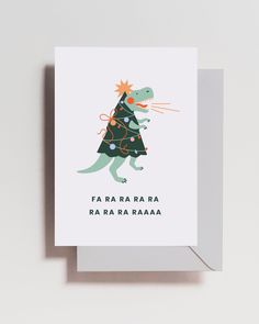 a christmas card with an image of a dinosaur wearing a tree on it's head