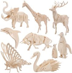 wooden cutouts of animals and birds are shown in this set on a white background