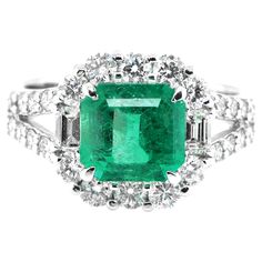 A stunning ring featuring a 1.97 Carat Natural Emerald and 1.10 Carats of Diamond Accents set in Platinum. People have admired emerald’s green for thousands of years. Emeralds have always been associated with the lushest landscapes and the richest greens. Today the majority of Emeralds are found in Zambia, Colombia and Central Asia. The ring is made in Japan. Ring size and stamping detailed below. Contact Us for more information. Ring Size: 11 (Japan), 6 (US/Canada), L 1/2 (UK/Australia) Stamping: Pt900 1.97 D1.10 --------------------------------------------------------------------------------------- Established in 1994, Rita Fine Jewelry has been making beautiful jewelry for the past 25 years plus. We specialize in Colored Stone Jewelry and offer a wide range of products including rings, Emerald And Diamond Ring, Emerald Diamond Ring, Colored Stone, Colombian Emeralds, Central Asia, Zambia, Emerald Diamond, Natural Emerald, Cocktail Rings