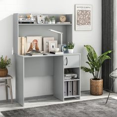 a grey desk with books and pictures on it