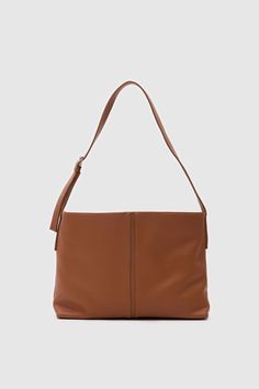 Elevate your style with this sophisticated faux leather shoulder bag. Designed for both elegance and functionality, this bag boasts a minimalist silhouette that complements any outfit. Material: Made from high-quality, smooth leather that provides a luxurious feel and long-lasting durability. Design: The bag features a clean, seamless design with subtle stitching along the edges, highlighting its refined craftsmanship. Its classic black color ensures versatility, making it an ideal accessory for Minimalist Leather Shoulder Bag With Detachable Strap, Daily Use Baguette Shoulder Bag With Smooth Grain, Minimalist Hobo Satchel Bag With Detachable Strap, Elegant Hobo Bag With Detachable Strap For Everyday, Elegant Everyday Hobo Bag With Detachable Strap, Elegant Daily Hobo Bag With Detachable Strap, Modern Everyday Leather Baguette Bag, Square Smooth Grain Shoulder Bag, Minimalist Hobo Bag With Adjustable Strap For Office