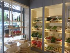 the inside of a grocery store filled with lots of fresh produce