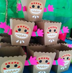 some brown paper bags with monster faces on them