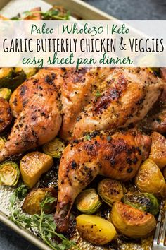 grilled chicken and veggies on a platter with text overlay that reads pale whole keto garlic buttery chicken and vegetables easy sheet pan dinner