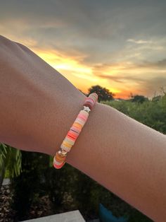 This beautiful bracelet inspired by the sunset, highlights they amazing moment when the sun begins to rise or fall, when everything seems calmer and happier. This bracelet was made with love and care by the sunset. Orange Bracelets For Beach In Summer, Rainbow Friendship Bracelets, Adjustable Orange Bracelets For Vacation, Sunrise Clay Bead Bracelet, Everyday Bohemian Rainbow Bracelets, Sunset Clay Bead Bracelet, Sunset Bracelet, Homemade Bracelets, Clay Bracelet