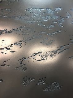 water droplets on the surface of a metal table