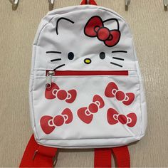 Adorable Hello Kitty And Friends Sanrio Mini Backpack White Hello Kitty With Red Bows Print Adjustable Straps, Has A Big Pouch And A Smaller Pouch In The Front Nwt Tags: Hello Kitty Sanrio My Melody Kuromi Summer Mini Backpack Bag Purse Kawaii White Backpack For Everyday Use, White Kawaii Backpack For Everyday Use, Cute White Standard Backpack, White Hello Kitty Backpack For Everyday Use, Cute Red Backpack For Everyday Use, White School Bag With Cat Design, White Hello Kitty Backpack For Daily Use, White Hello Kitty Print Backpack For Daily Use, White Hello Kitty Kawaii Bag