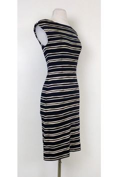 Make a statement in bold stripes! This nautical inspired dress is lightweight and stylish. Pair it with a red lip and chic wedges for a day time ready ensemble. Size XS 100% silk Boat neck Slips on Striped pattern Sleeveless Fitted Bust 32" Waist 28" Shoulder to hem 38" Chic Dresses With Horizontal Stripes, Chic Sleeveless Dress With Striped Hem, Chic Fitted Dress With Contrast Stripes, Chic Vertical Stripes Midi Dress For Beach, Chic Beach Midi Dress With Vertical Stripes, Chic Midi Dress With Vertical Stripes For Beach, Fitted Summer Dresses With Striped Hem, Fitted Sleeveless Midi Dress With Vertical Stripes, Summer Striped Midi Dress For Workwear