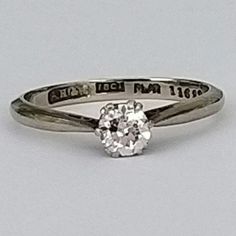 A beautiful old cut diamond, platinum & gold ring with tapered shoulders. The diamond is in excellent condition, extremely bright and very sparkly in natural daylight. Elegance and quality from the 1920's - 1940's, perfect for a special occasion. ▪ Overall Condition: Excellent ▪ Metal: Platinum & 18ct White Gold ▪ Gem: Diamond 40ct ▪ Gem Clarity: Si ▪ Gem Cut: Old Cut ▪ Gem Colour: H ▪ Ring Size UK: L ▪ Ring Size US: 5.85 ▪ Resizing: Quotation Available ▪ Marked: "Plat" & "18ct"  ▪ Weight: 2.0 g Silver Engraved Ring With Single Round Cut Diamond, Diamond White Solitaire Diamond Ring For Marriage, White Gold Solitaire Diamond Ring For Marriage, Classic Single Diamond Jewelry For Marriage, Diamond White Solitaire Ring For Marriage, Classic Cut Diamond Ring With Single Diamond For Anniversary, Brilliant Cut Diamond White Diamond Ring For Marriage, Classic Diamond White Diamond Ring For Marriage, Classic Engraved Ring With Single Round Diamond