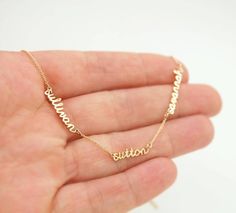 This is a tiny names necklace with 1, 2, 3, 4 pendants and 0.5in chain spaces between names. I make this mom necklace in 14K yellow gold, 14K rose gold, 14K white gold, with a cable chain. Different chain lengths are available. I could add a diamond or a birthstone to the necklace - contact me. Jewelry Mexican, Necklace With Kids Names, Names Necklace, Mommy Necklace, Handwriting Jewelry, Dainty Diamond Necklace, Mother Jewelry, 18k Gold Necklace, Family Necklace